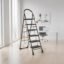 Amazon Basics Clamber - Foldable Step Ladder, Safety-Clutch Lock, Ribbed Steps, Knee Guard, Non-Marring PVC Shoes, 6 Steps (Steel, Black & Orange)