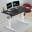 JIN OFFICE Octave Height Adjustable Table Electric | Sit Stand Desk, 2 Year Warranty, 80 Kg Wt. Cap| Standing Desk with Memory Preset, Cup Holder| Stability Crossbar| Black 1200*750mm/25mm Thick Top
