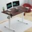 JIN OFFICE Octave Height Adjustable Table Electric | Standing Desk, 2 Year Warranty, 80 Kg Wt. Cap| Sit Stand Desk with Memory Preset, Cup Holder| Stability Crossbar| Brown 1200*750mm/25mm Thick Top