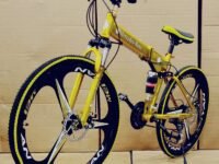 Sunspeed Skyride BMV X6 Foldable Cruiser Bicycle | 21-Speed Gears | Dual Disc Brakes | Dual Hydraulic Suspension | Carbon Steel Frame | 26-Inch City Ride Bike | Yellow